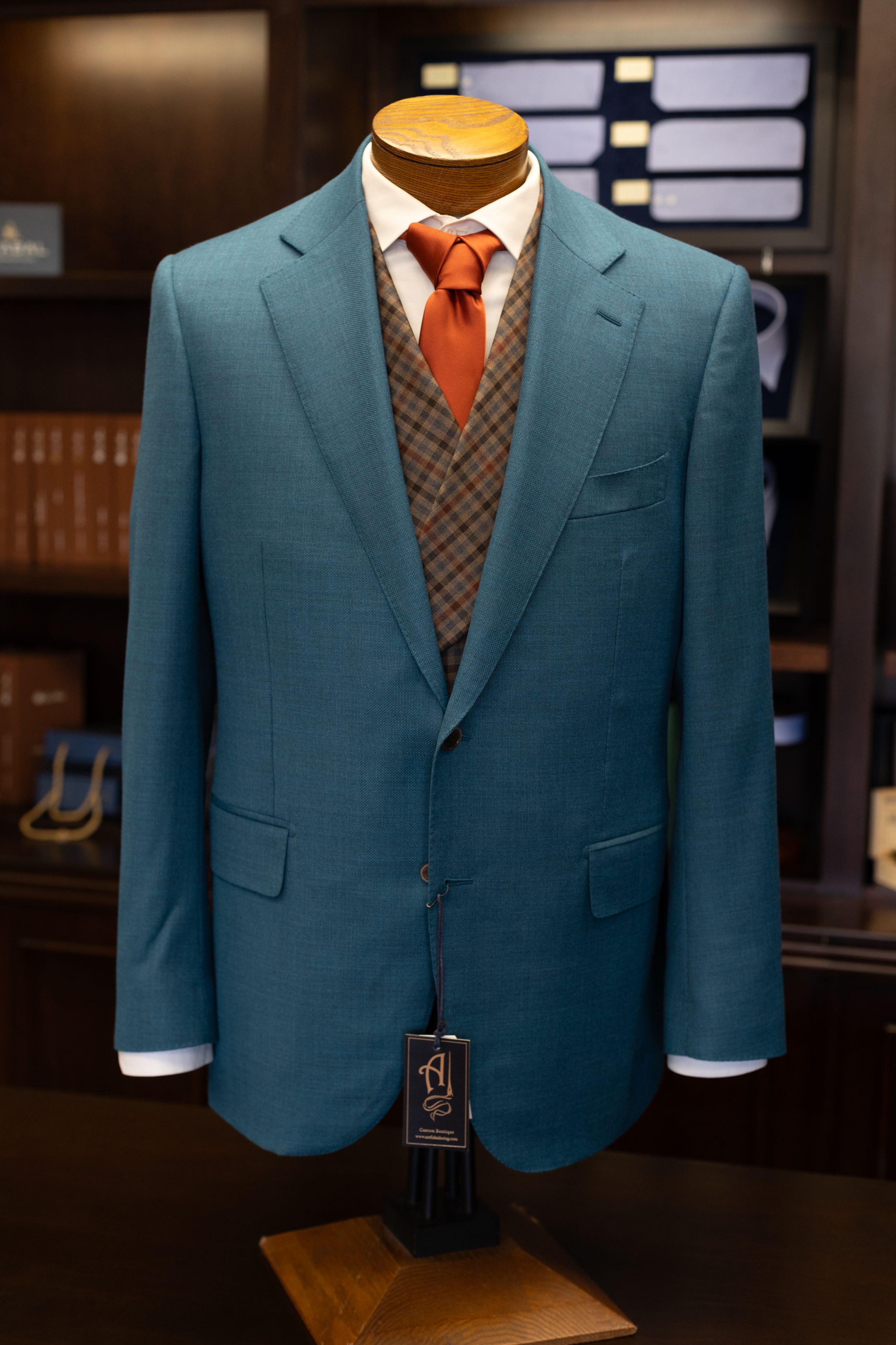 teal suit jacket with plaid vest