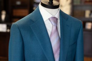 teal men's suit with pastel tie outfit